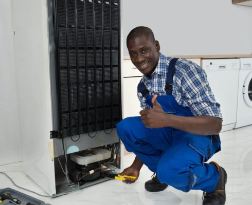 photodune-12098861-technician-fixing-refrigerator-m-1024x683